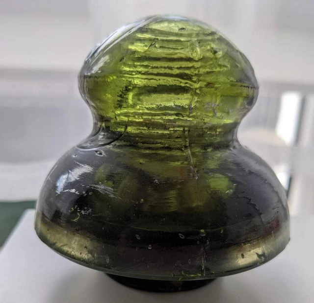Old glass insulator rare dark olive yellowy green color UFO style Poland CD 472