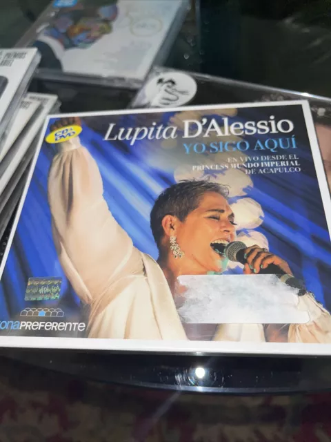 CD DVD Lupita D'alessio - Yo Sigo Aqui -En Vivo Princess Mundo Imperial Acapulco