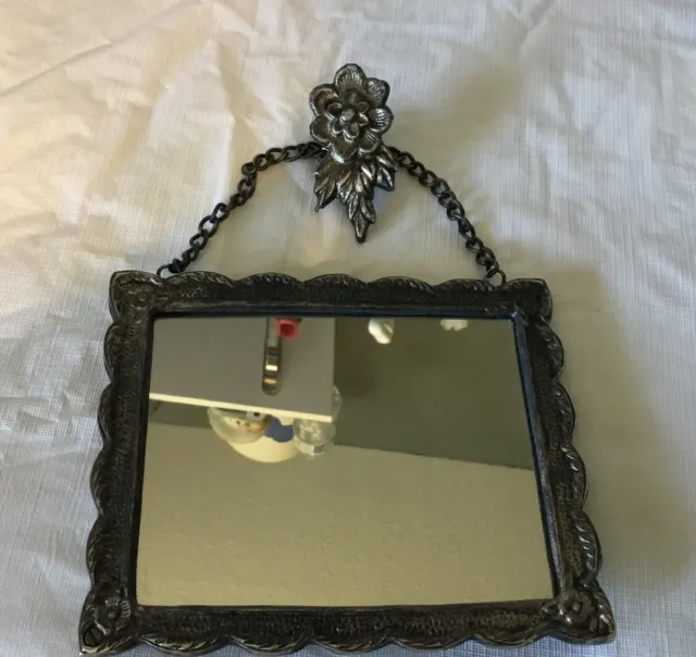 Victorian Hanging Mirror Silver Toned Decorative Back And Ornate hanger , Heavy