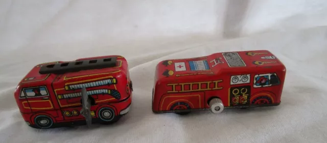 Two Vintage LITHO Wind-Up Fire Engines