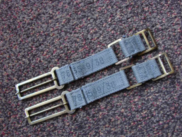 Pair MINT NOS 1938 dated RAF 1925 pattern webbing brace attachments.