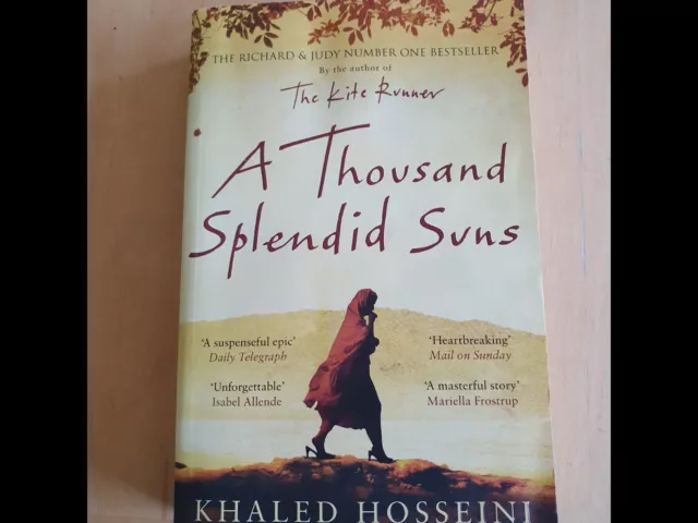 A thousand Splendid Suns paperback novel by Khaled Hosseini. Preowned. Good cond