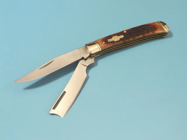 ROUGH RYDER RR072 RAZOR TRAPPER Amber Jigged Bone pocket knife 4 1/8" closed NEW