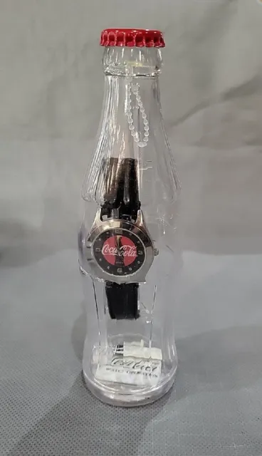 2002 Coca-Cola Silver/Black/Red Face Watch in Plastic Bottle Bank