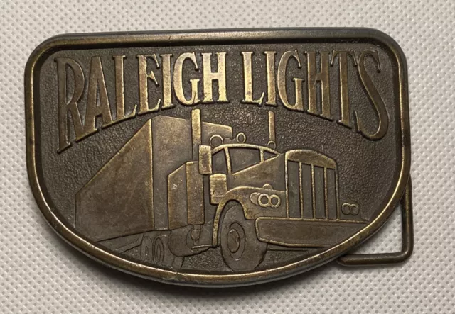 Vintage Trucker Raleigh Lights Cigarettes Advertising Belt Buckle