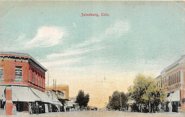 J9/ Julesburg Colorado Postcard c1910 Main Street Stores Bicycle 69