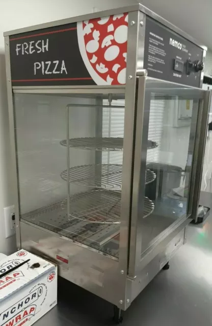 Nemco pizza warmer, 33 1/2 Tall, 19 1/2 deep, 4 inch legs. Pizza turner & lights