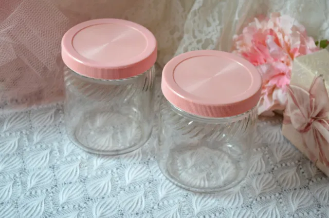 2 VINTAGE glass jars with pink lids, peanut butter Hoosier kitchen canister