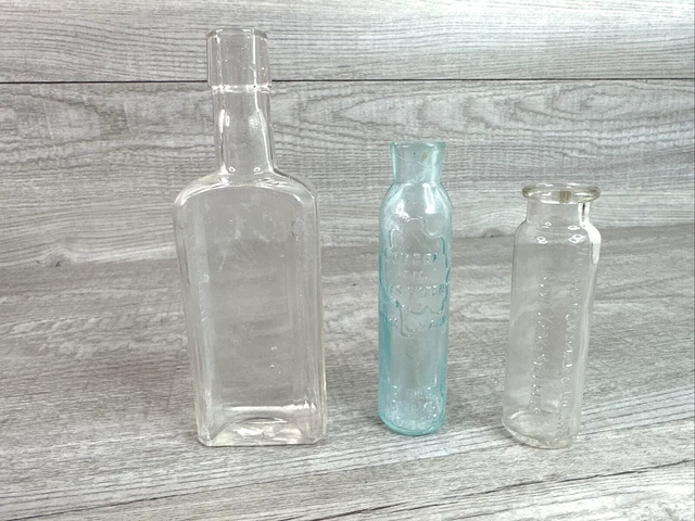 Lot of 3 Vintage Embossed Quack Medicine Bottles