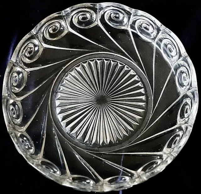 Vintage pressed glass bowl  scalloped edge swirl and star burst design 23 cm