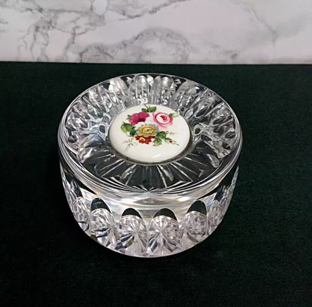 Round Crystal clear paperweight With a Floral Ceramic Decoration