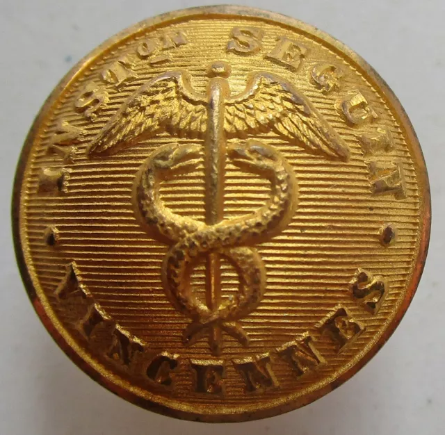 Bouton creux en métal doré : Institution Seguin Vincennes au caducée ailé, 21 mm