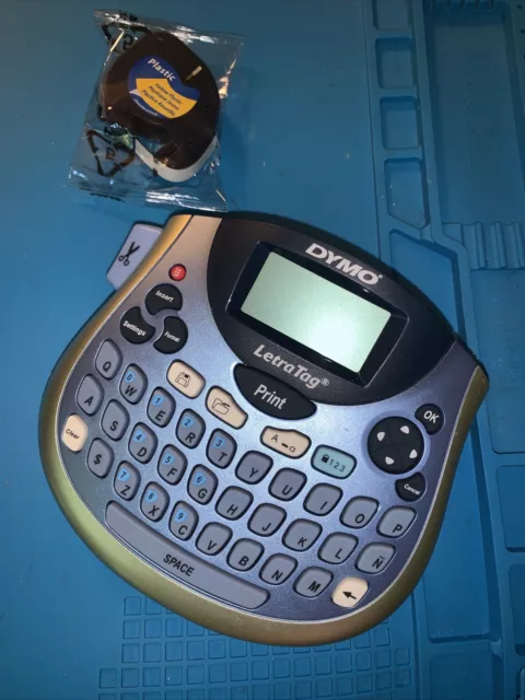 Dymo LetraTag 100T Table Top Label Maker with a yellow tape
