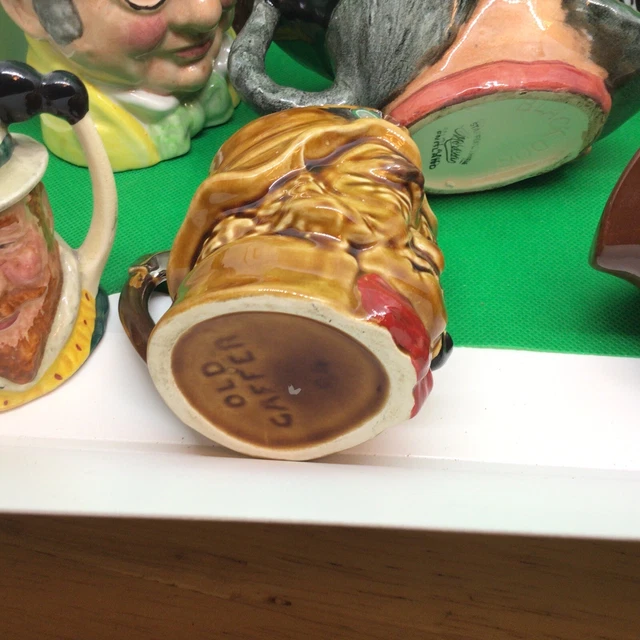 A collection of 10  toby jugs To Hand-Painted Toby Jugs￼ 3