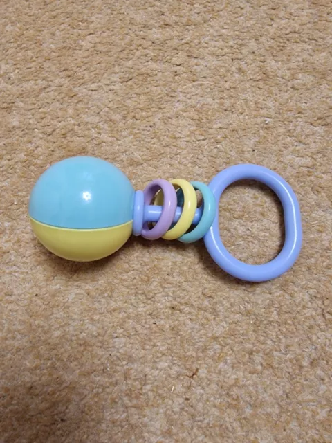 Vintage baby rattle in purple, yellow and green, three rings and ball rattle