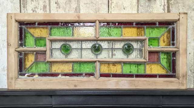 A RECLAIMED ANTIQUE STAINED GLASS WINDOW WITH PINE FRAME Ref M1967