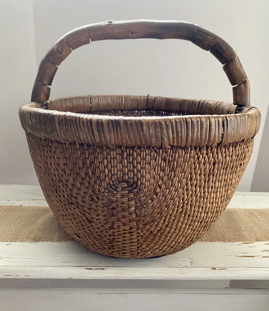 A mid-20th century Chinese woven reed rice gathering basket