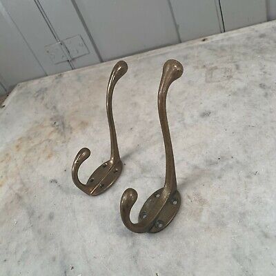 Couple antique Victorian brass hooks