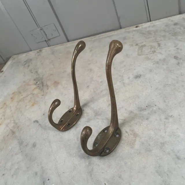 Couple antique Victorian brass hooks