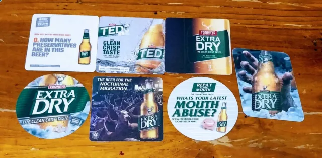 Set of 7 assorted Tooheys Extra Dry beer coasters.