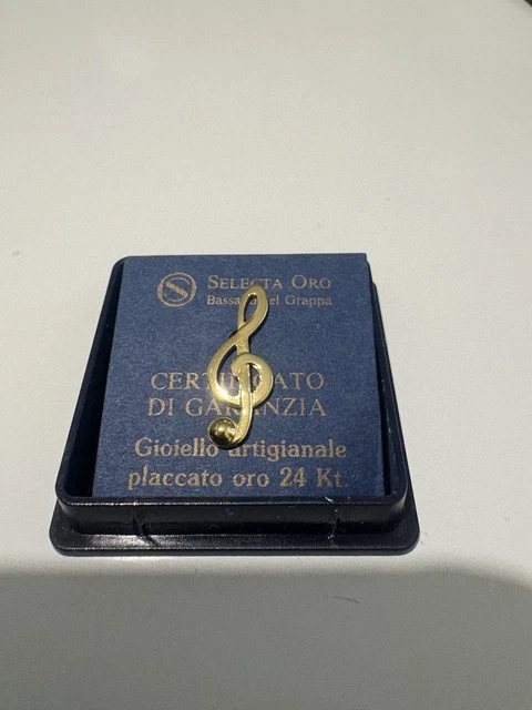Golden chiave di violino segno su sfondo nero - chiave di sol - musica