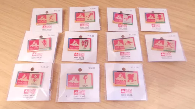 BM537: Collection of 11 Sion Winter Olympic 2006 Candidate Badges in Packs