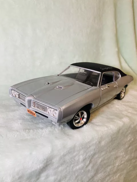 ERTL - 1:18 American Muscle Arnie "the Farmer" Beswick 1969 Pontiac GTO Silver