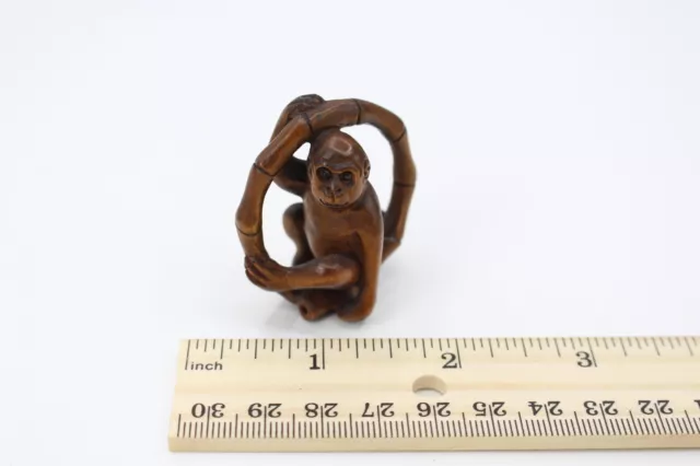 Netsuke Monkey in a Bamboo Ring - Japanese Carved Boxwood - Signed