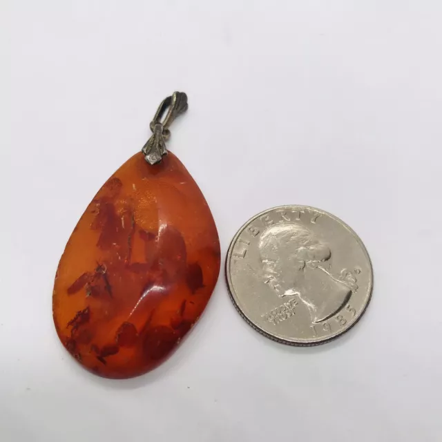 Antique shop amber pendant