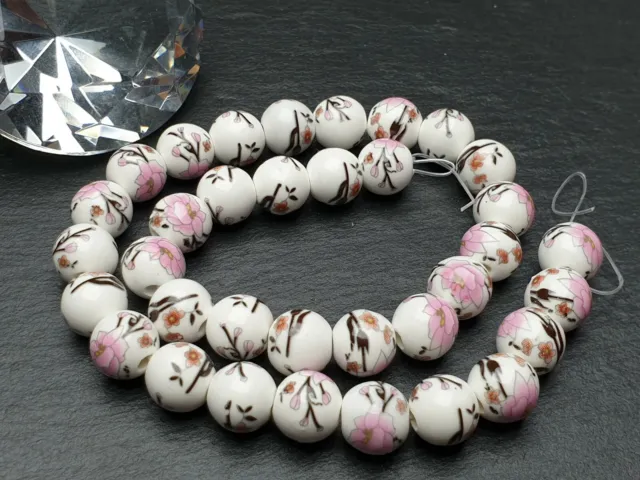 Strang 34 cm dutch beads / Keramik Porzellan Perlen rosa Blumen Muster 10 mm