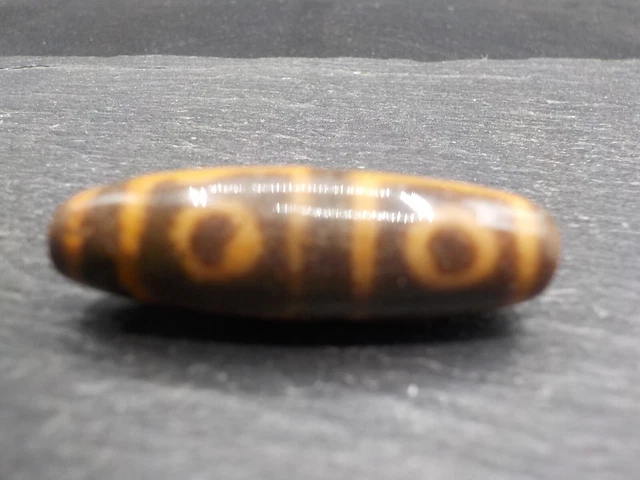 An Agate Dzi bead with a 4 Eye pattern from Tibet / Nepal.