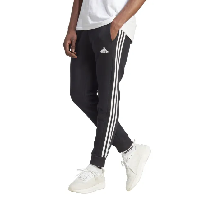 Adidas Pantaloni da Uomo Essentials Fleece 3-Stripes Tapered Cuff Nero Codice...