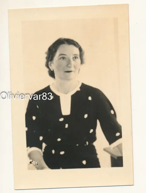Vintage photo - woman in dotted dress on white background portrait