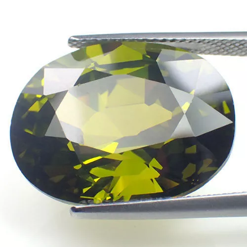 A PAIR OF 6x4mm OVAL-FACET OLIVE-GREEN CUBIC ZIRCONIA GEMSTONES