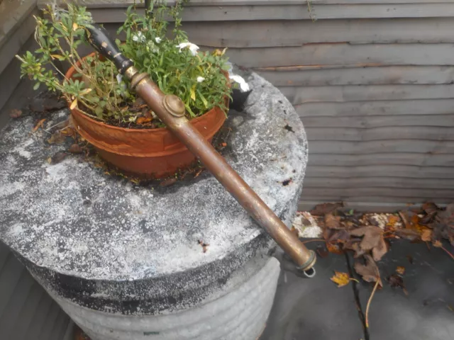 Old brass garden spray, 20 inches long, turned wood handle.