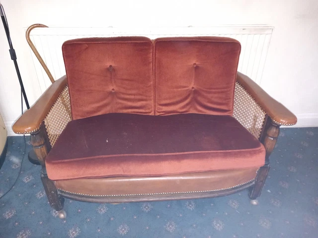 Bergere cane work sofa and two chairs