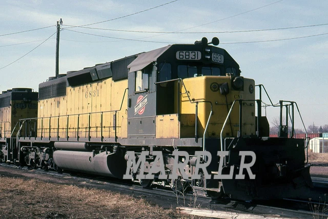 RR Print-CHICAGO & NORTH WESTERN CNW 6831 at North Fond du Lac Wi 3/25/1984