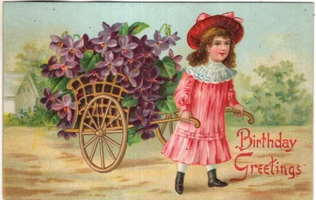 ANTIQUE EMBOSSED BIRTHDAY Postcard   YOUNG GIRL IN PINK, PULLING CART OF VIOLETS