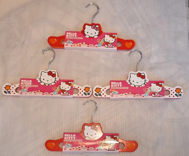 NEW Hello Kitty Hangers 4 packs 12 hangers Hearts Flowers Wood Sanrio 2012 NIP