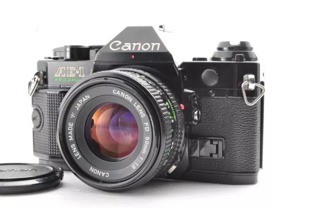 Programa Canon AE-1 Cámara de película SLR negra casi perfecta con lente FD...