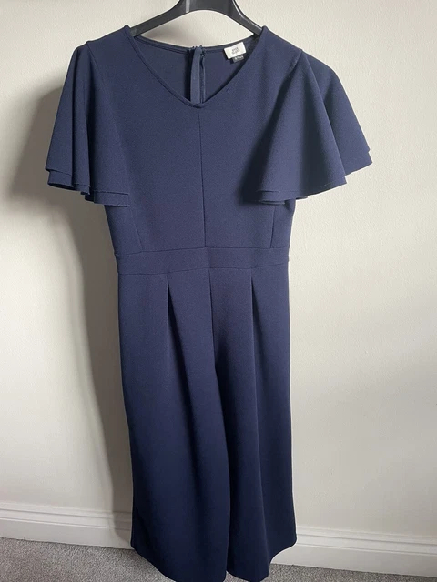 Tuta blu navy ragazza River Island con maniche svasate. Età 9-10.