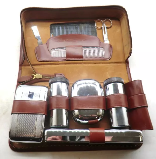 A VINTAGE GENTS Chrome Plated Travel Grooming Set In Leather Case