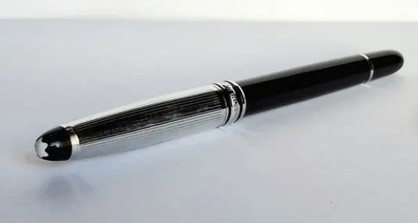 Black metal fountain pen with silver cap and new Montblanc blue ink cartridge