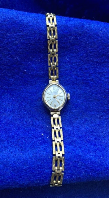 Avia ladies 9ct gold watch top