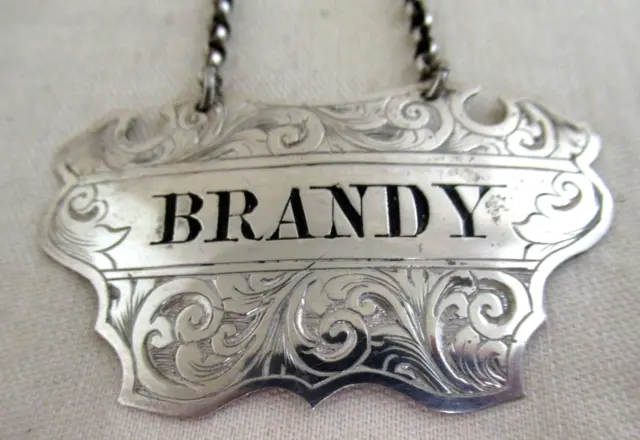 Solid Silver "BRANDY" ORNATE SPIRIT LABEL - Hallmarked:-Birmingham 1872