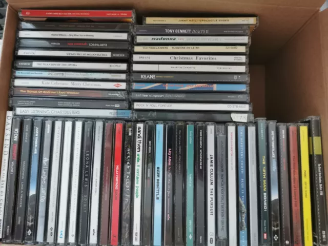 A Bulk Lot Of 52 Cds & 2 Dvds