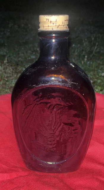 1970’s Vintage Native American Log Cabin Syrup Bottle. Embossed Amber Glass.