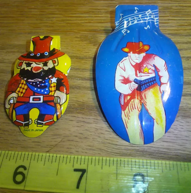 2 Tin litho clickers