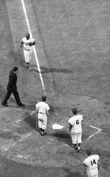 Brooklyn Dodgers Jackie Robinson in action running to home plate v - Old Photo