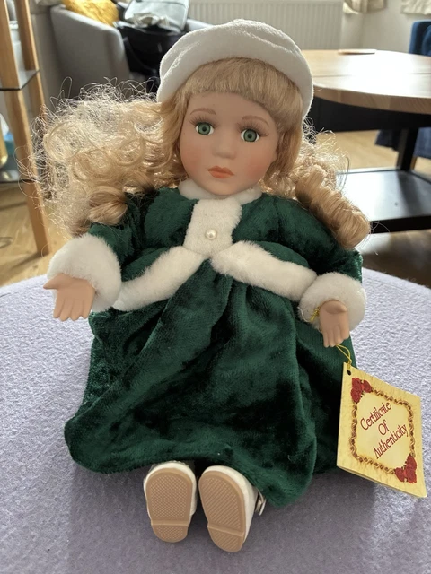 porcelain doll green velvet dress Vintage 16" Porcelain Doll Wearing Velvet Green Dress and Hat With Blond Hair and Hand Painted Facial Features